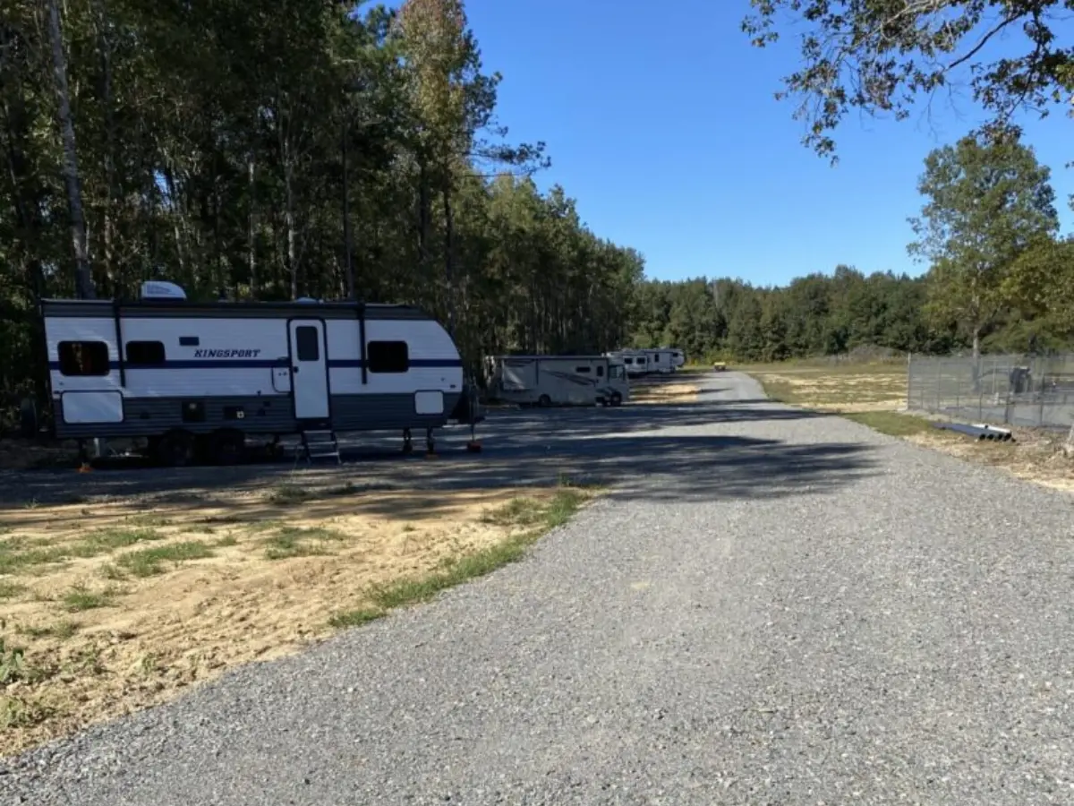 A large rv parked on the side of a road.